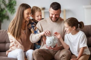 Happy family saving money together